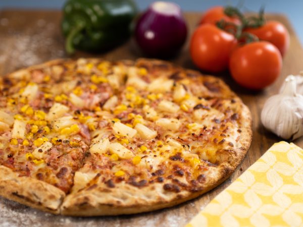 Inviting Hawaiian Pizza topped with tropical flavors in Eastbourne