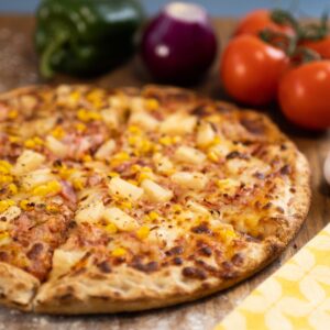 Inviting Hawaiian Pizza topped with tropical flavors in Eastbourne